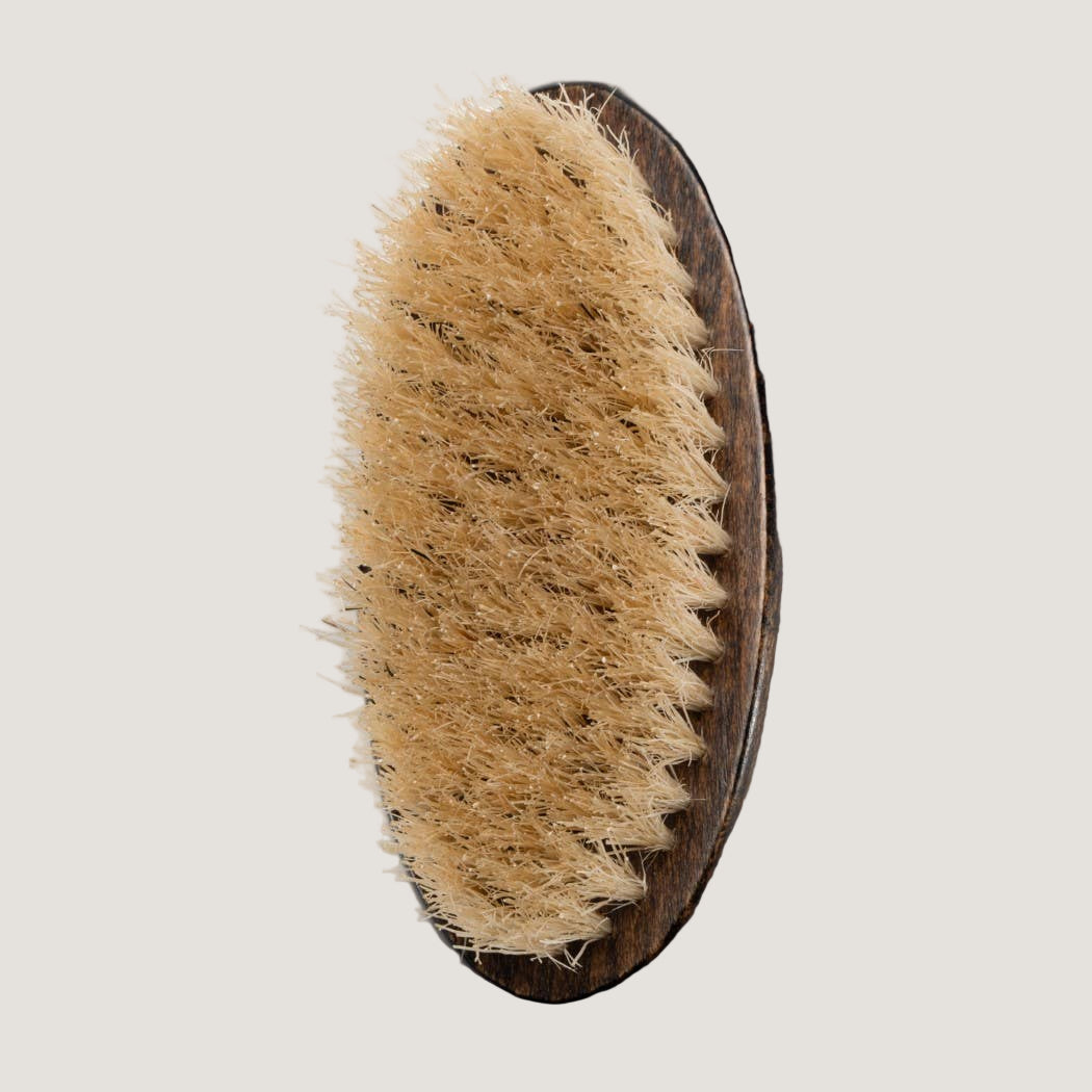 Natural bristle brush on a white background
