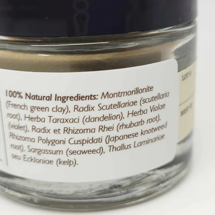Glass jar with a label listing natural ingredients on a white background