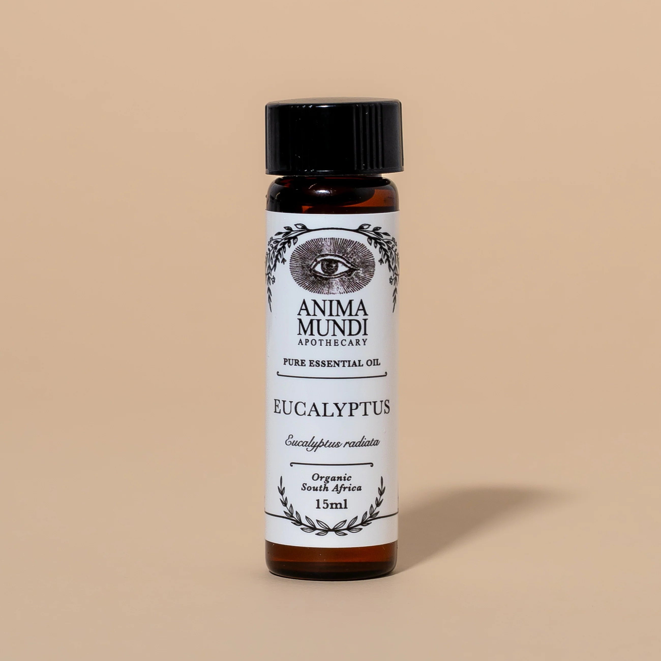 Anima Mundi Eucalyptus essential oil bottle on a beige background