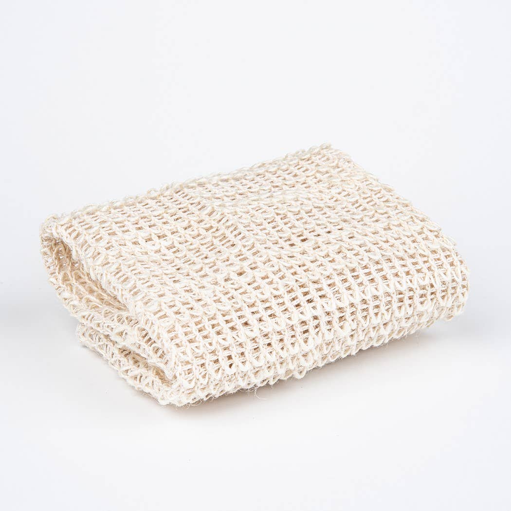 Folded beige crochet blanket on a white background
