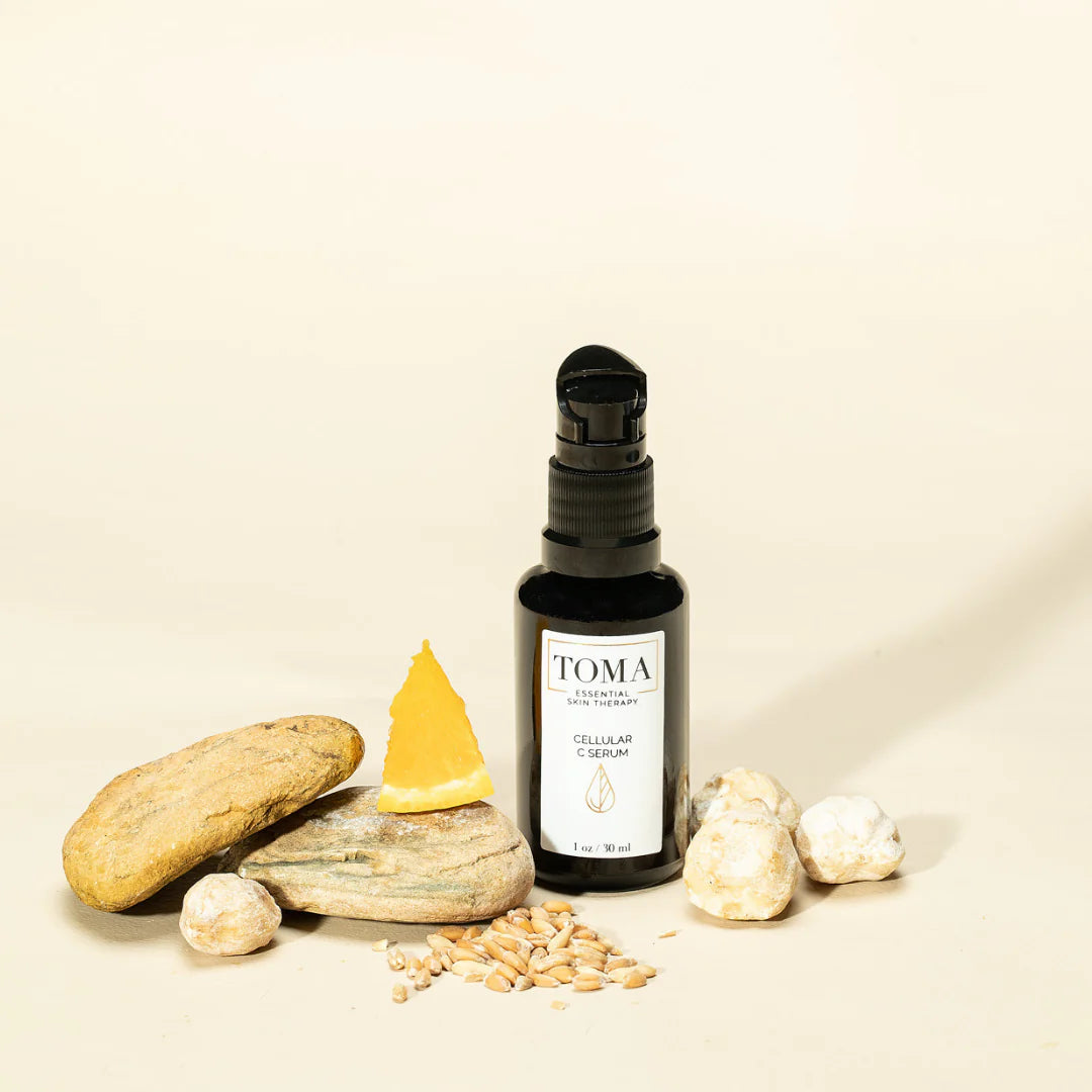 TOMA skincare product with natural elements on a beige background