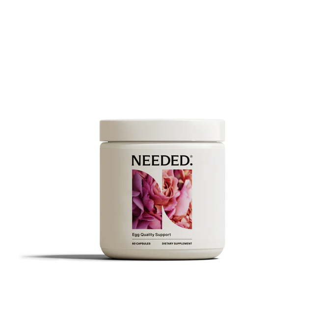 Supplement container labeled 'NEEDED' on a white background
